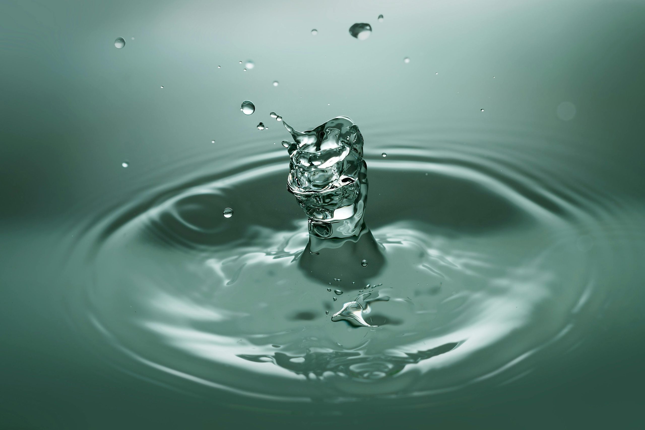 Captivating image capturing the elegance of a water droplet splash with macro precision and clarity.